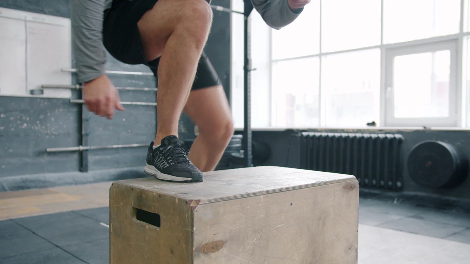 An athlete doing box jumps to build explosive power